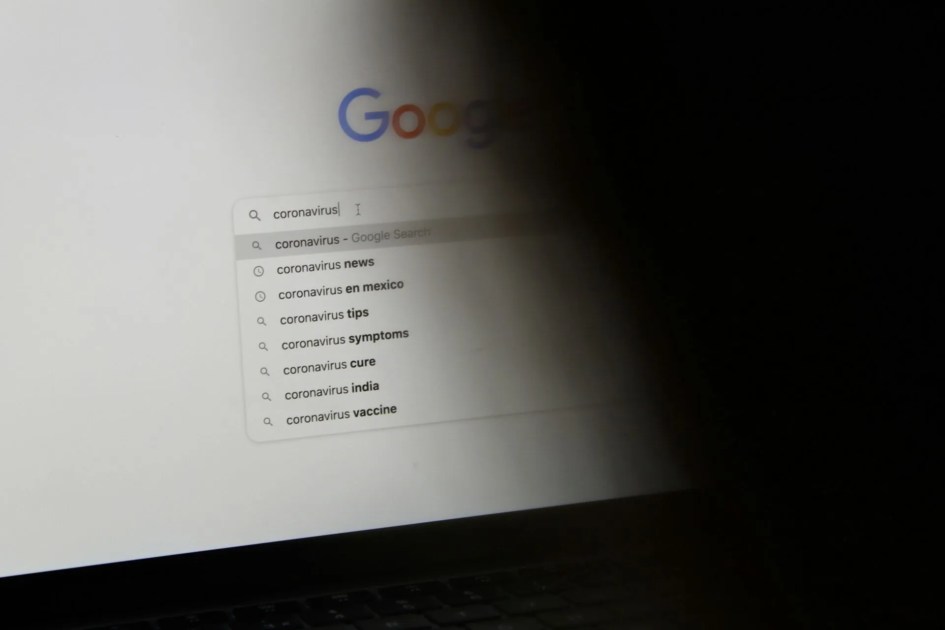 black laptop computer turned on displaying google search